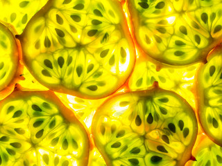 texture of kiwano melano slices arranged back lit