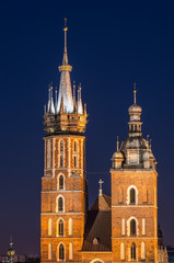 Fototapeta na wymiar Krakow, Poland, Virgin Mary church on the Main Market Square seen from the Town Hall tower in the night