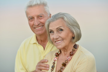 elderly couple  on the background of sky