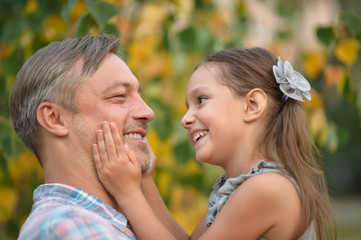 Fototapeta premium father with daughter in summer park