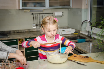 child cooking with dough