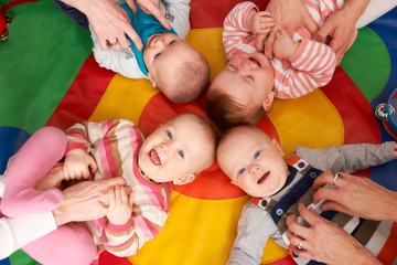 Overhead View Of Babies Having Fun At Nursery Playgroup - obrazy, fototapety, plakaty
