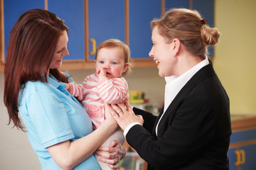 Working Mother Dropping Child At Nursery