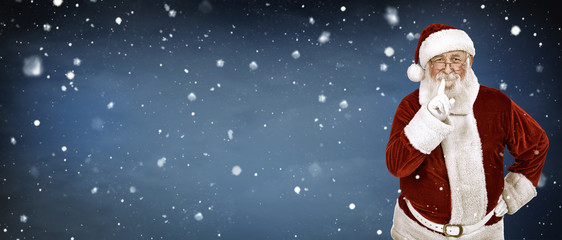 real Santa Claus on snow background