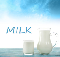 Pitcher and glass of milk on light blue background