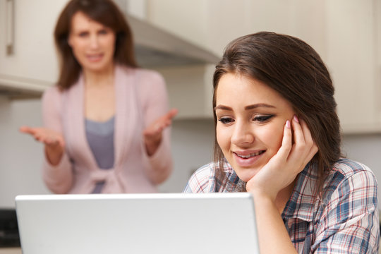 Mother Arguing With Teenage Daughter Over Online Activity