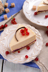 Tasty cheesecake with berries on table close up