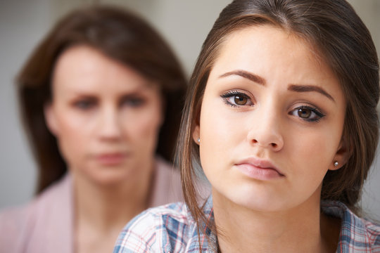 Portrait Of Worried Mother With Teenage Daughter