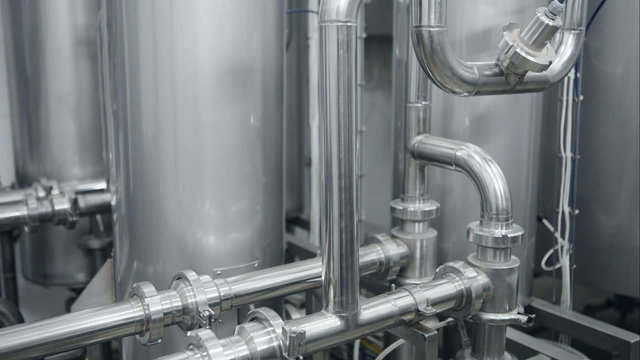 Modern boiler room equipment for heating system. Pipelines, water pump, valves, manometers