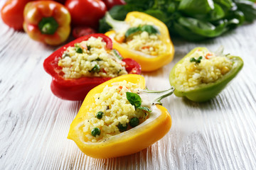 Stuffed peppers with vegetables on table close up