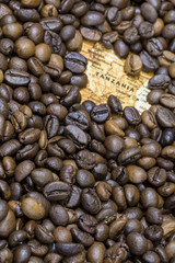Map of Tanzania under a background of coffee beans