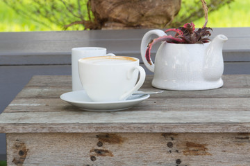 Coffee cup on the wooden table