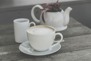 Coffee cup on the wooden table