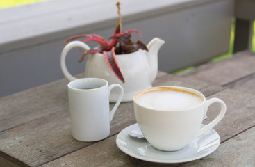 Coffee cup on the wooden table