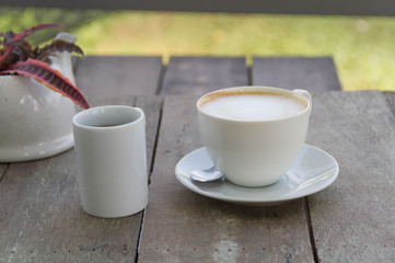 Coffee cup on the wooden table