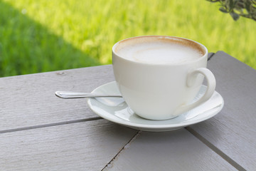 Coffee cup on the wooden table