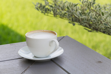 Coffee cup on the wooden table