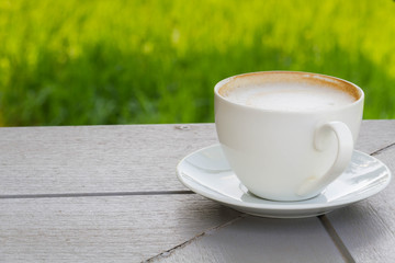 Coffee cup on the wooden table
