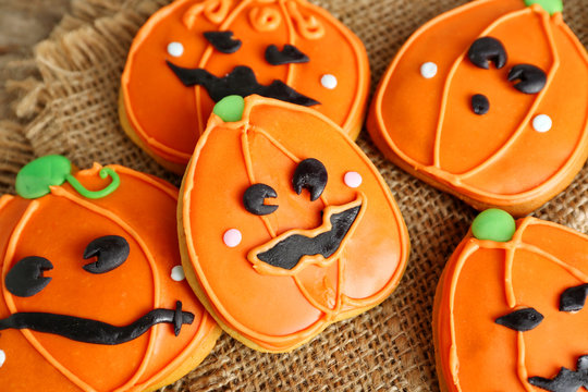 Creative cookies for Halloween party on sacking background