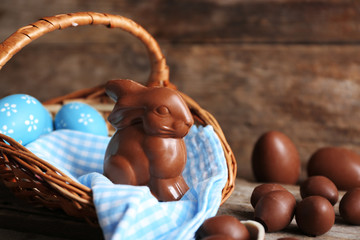 Easter chocolate bunny and eggs on wooden background