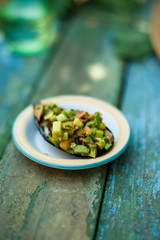 Oyster stuffed with vegetables on a saucer