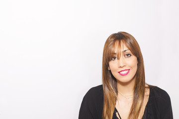 Obraz premium Attractive young woman with long hair smiling over white background