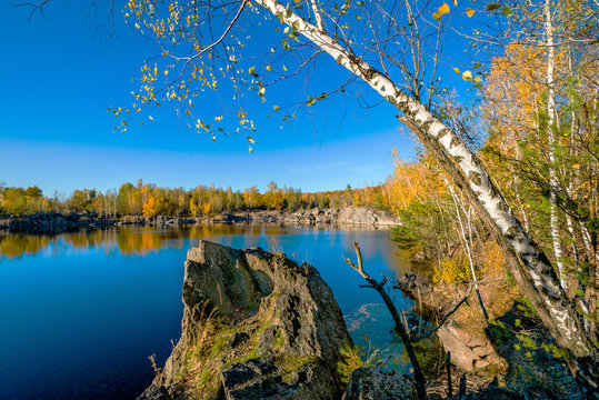 Granite stone pit.  Abandoned Granite Stone Pit is in the autumn.  