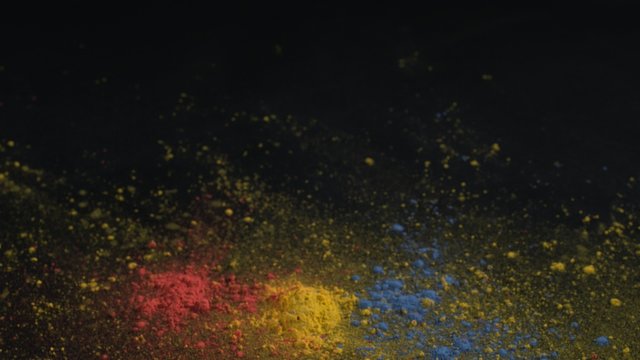 Camera follows particles exploding against black background. Shot with high speed camera, phantom flex 4K.  Slow Motion. Unedited version is included at the end of clip.