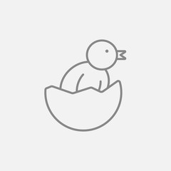 Chick peeking out of egg shell line icon.