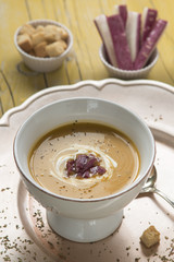 Cream of pumpkin soup with purple carrots