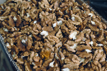 Heap of walnut lying in paper box