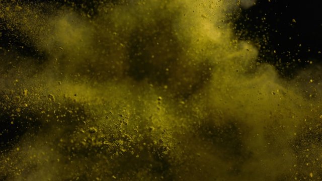 Particles/powde exploding against black background. Shot with high speed camera, phantom flex 4K.  Slow Motion. Unedited version is included at the end of clip.