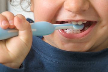 detail of a child washing teeth