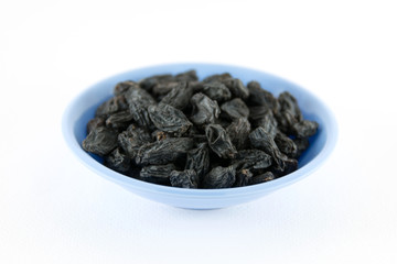 Dried grapes on white background
