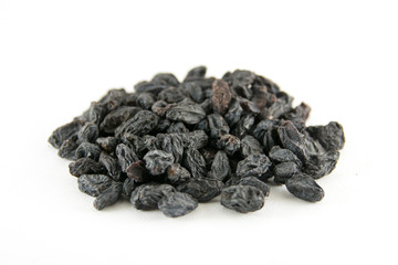 Dried grapes on white background