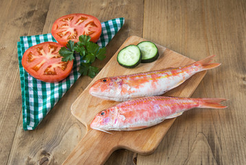 Fresh red mullet with tomatoes and parsley