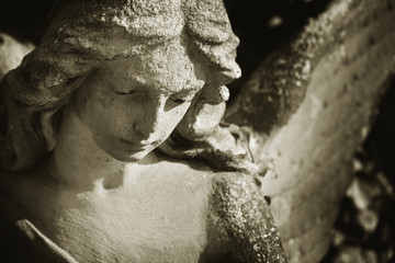 Beautiful close up af a face angel sculpture with a sweet expres