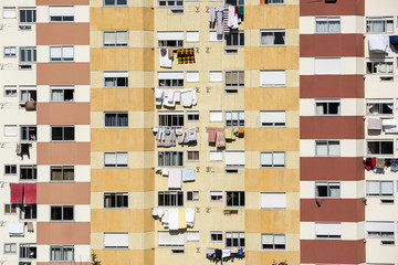 an apartment building with clothes drying outdoors