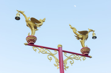 Couple Swan sculpture lamp on blue sky and the moon