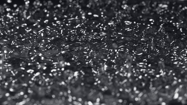 Water surface bouncing and making splash. Shot with high speed camera, phantom flex 4K. Slow Motion. 