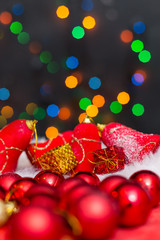 Obraz premium Christmas background with a red ornament, golden gift box and fi