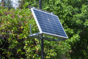 Solar battery powers an electric lamp in the park