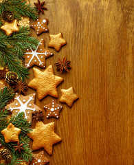 Obraz na płótnie Canvas Christmas tree branches on wooden background with decoration