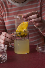 Hot drink from a sea-buckthorn in a glass cup