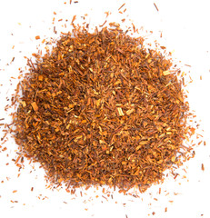 Dried rooibos herbal tea leaves over white background