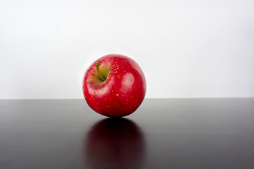  Red apple on a black background