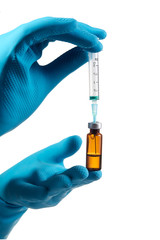 Hands of the doctors filling a syringe