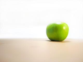 Green apple on the table