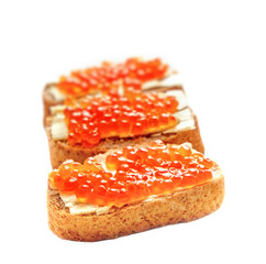 Red caviar with bread and butter on the white background