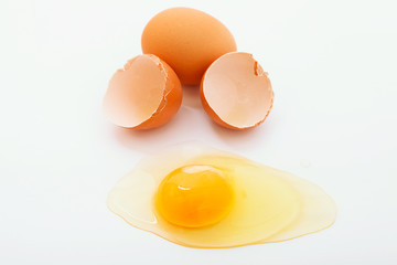 Broken egg on white background